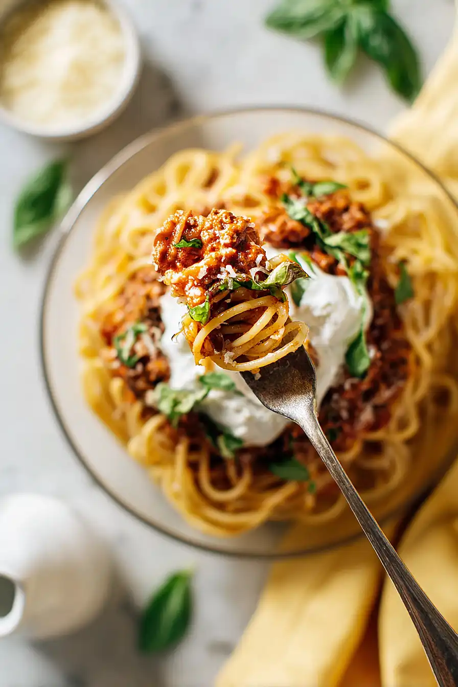 spaghetti bolognese with burrata