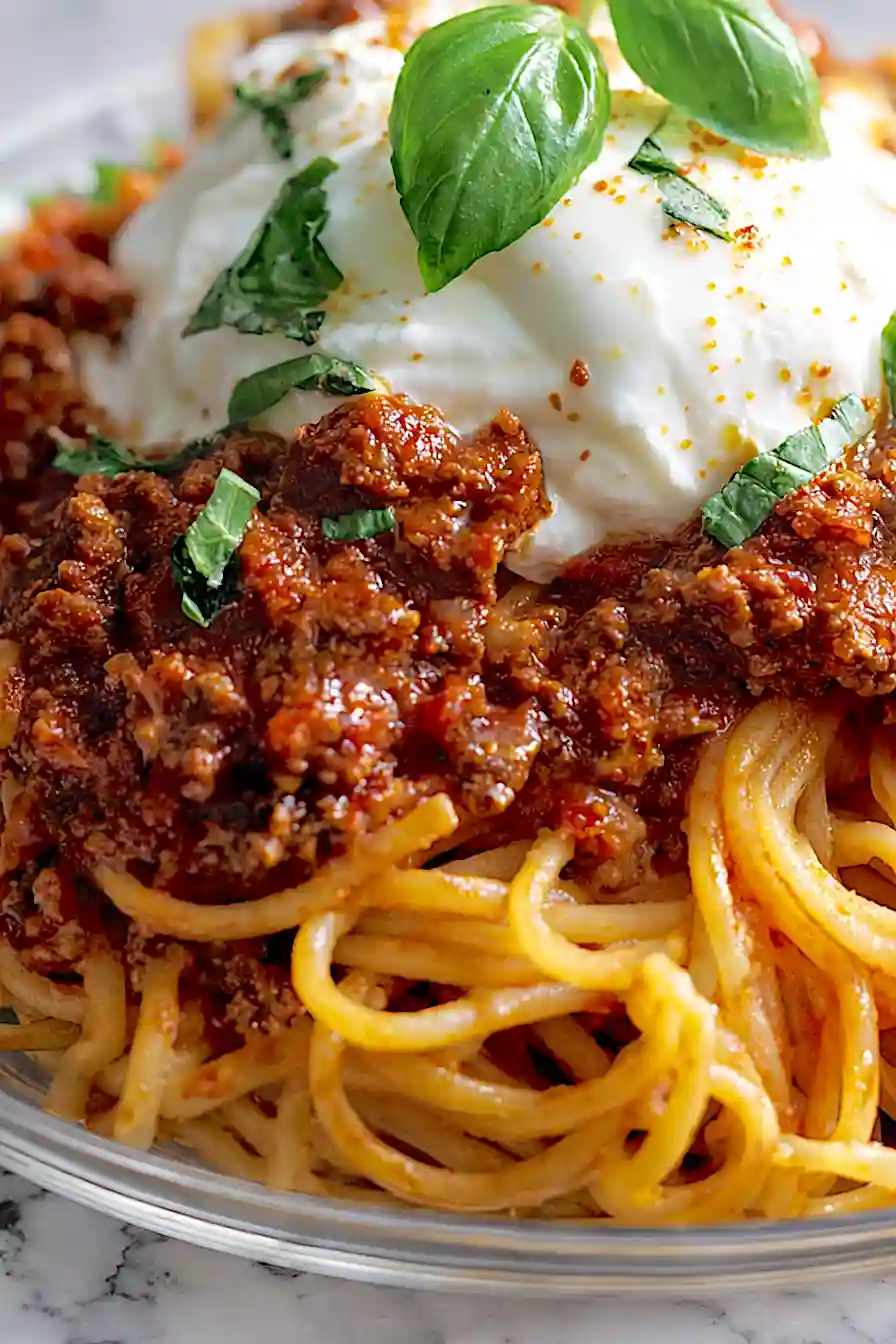 spaghetti bolognese with burrata